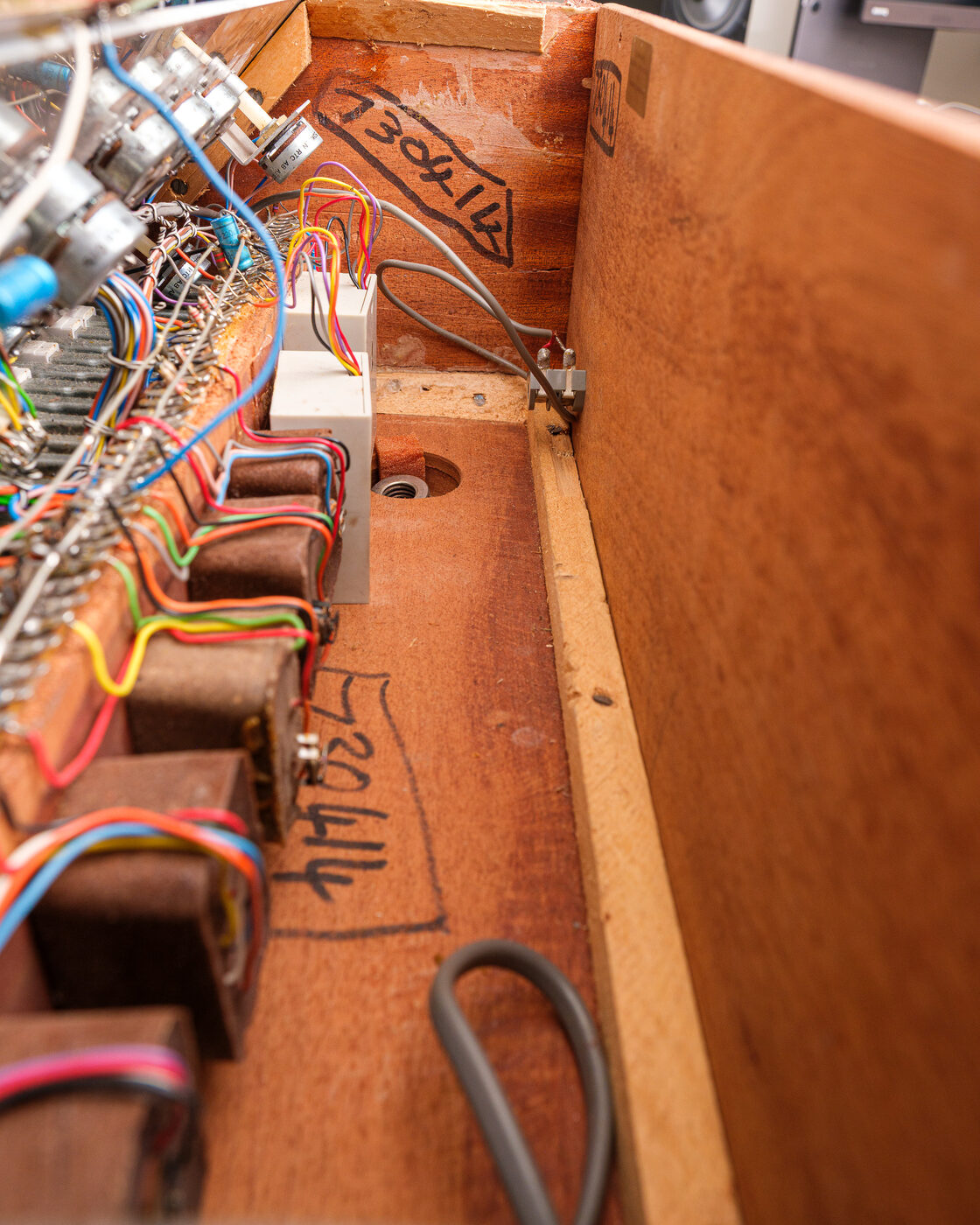 Hand-written markings inside the wooden case
